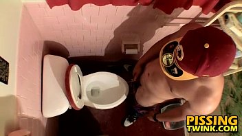 Cute Twink Flops Out His Cock And Pisses In The Toilet Bowl