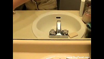 Male Models William Is Trying To Neat Makeup Off The Bathroom Mirror