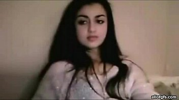 Beautiful Indian Woman With Long Black Hair In Her Robe Sitting On A Bed