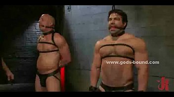 Couple Of Gay Sex Toys Bound In Leather