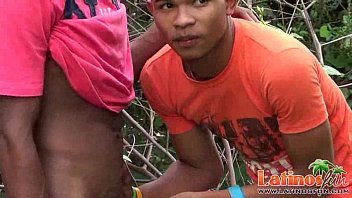 Two Handsome Latinos Tasting Meat In The Forest