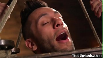 Suspended Bdsm Sub Caged For Cock Tugging