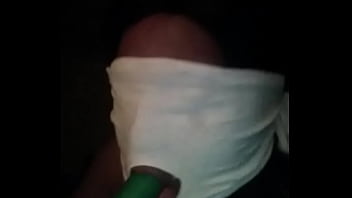 Sucking On A Green Dildo With Mouth Mask