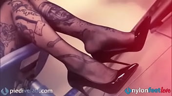 Sexy Tattoed Secretary In Pantyhose Shows Her Feet