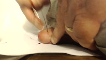 Large Pin Through Cockhead - B. Gushes When Extracted