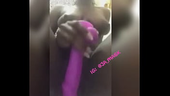 Jamaican Mask Model Plays With Toy