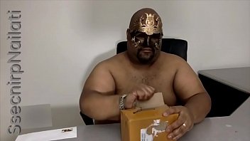 A Brown Man Unboxing A New Toy.