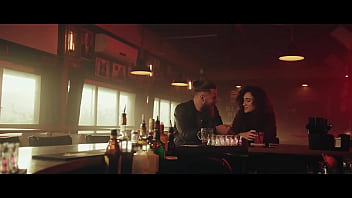 Man And Woman Kissing Sitting In Bar With Pink Lights