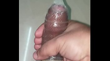 Indian Man Cums In A Dotted Condom