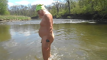 Naked Driver Stands Up In The River And Shakes Off