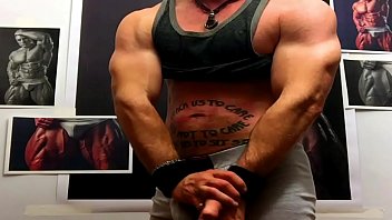 Declan Stone Flexing And Jacking At The Wall Of Muscle