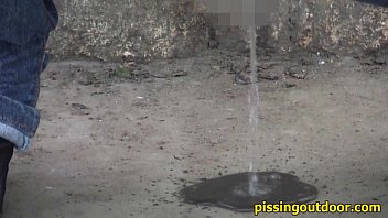 Aliya Pisses Behind The Rock