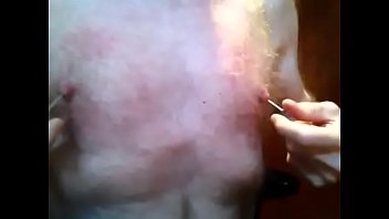 Large Nails Being Removed From Nipples