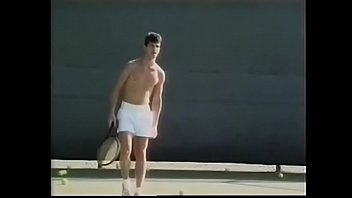Tennis Player Likes To Loosen His Penis Stiff Muscles After Excercises With Ball Shooter Machine And Drop His Load On His Tennis Racket