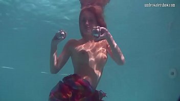 Redhead B. Nikita Vodorezova Gets Naked Fast Underwater