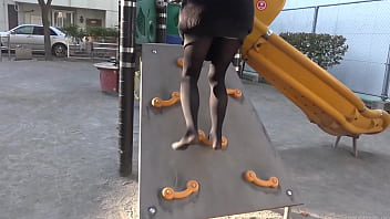 Girl Walks On The Sand In The Park In Black Tights
