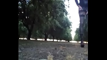 Crossdresser Walking In The Almond Orchard