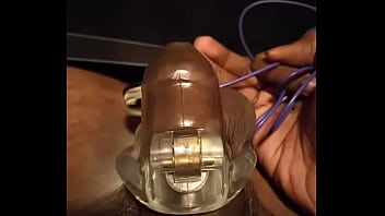 Cock Vibes In Cage With Plug In Ass