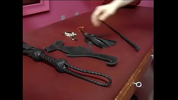 Wild Brunette In Red Latex Lingerie Ties Up Slutty Chick And Spanks Her Yummy Ass With A Whip