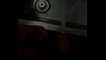 Peeing Into A Stainless Steel Urinal