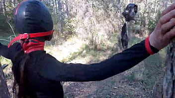 Tied Up To A Tree Outdoor On Sexy Clothes, Wearing Pantyhose And High Ankle Boots Heels