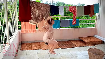 The Stupid Housewife Hangs Up The Washed Laundry.