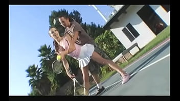 Cheerful Brunette In A Short Skirt Gives A Guy A Blowjob On The Tennis Court