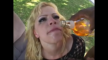 Street Girl In Fishnet Stockings Drinks From A Bottle And Gives Blowjob To Black Guy In The Backyard