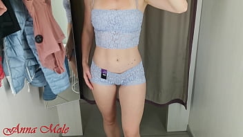 A Girl With A Perfect Figure In A Fitting Room Trying On Different Beautiful Lingerie.