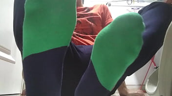 Green Sweaty Socks And Barefeet After Work