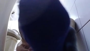 Sweaty Blue Socks And Barefeet In The Bathroom