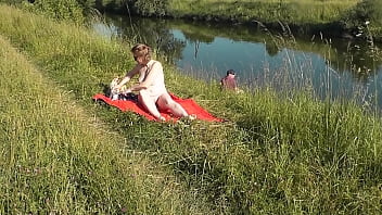 Milf Sexy Frina On River Bank Undressed And Sunbathes Naked. Random Man Fisherman Watching For Her, And In The End De...