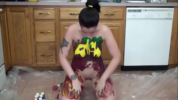 A Beautiful Brunette With Big Tits Coats Her Body With Colorful Paints In The Kitchen On The Floor And Enjoys