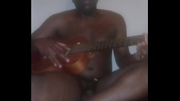 Lay Major A.k.a Llamasr Wearing A Banana Mask On Top Of Face For Cosmetic Therapy While Freestyle Playing A Guitar For Free And For Fun