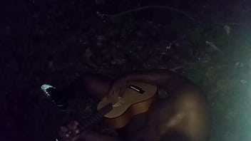 Singing And Playing The Guitar While Enjoying The Last Full Month Of Summer Outdoors Around Midnight