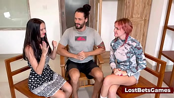 Two Sexy Girls Are Playing A Copycat Strip Game In A Threesome