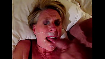 Short-haired Mature Blond Cumslut Beth Masturbates To A Climax While Taking A Huge Cum Facial. She Swallows Some And Rubs It Into Her Face, Then Sucks His Cock And Balls #cumslutbeth