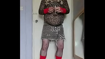 Gay Crossdresser Enjoying The Taste Of His Two Glasses Of Pee That Has Just Come Out Of His Cock